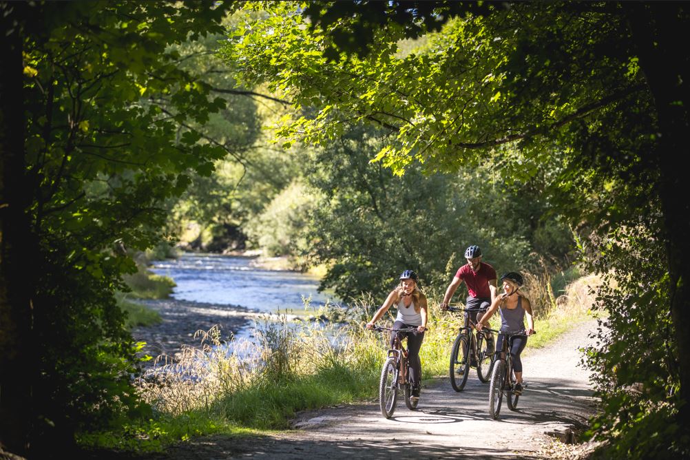 Biking alongside the Arrow River in Arrowtown