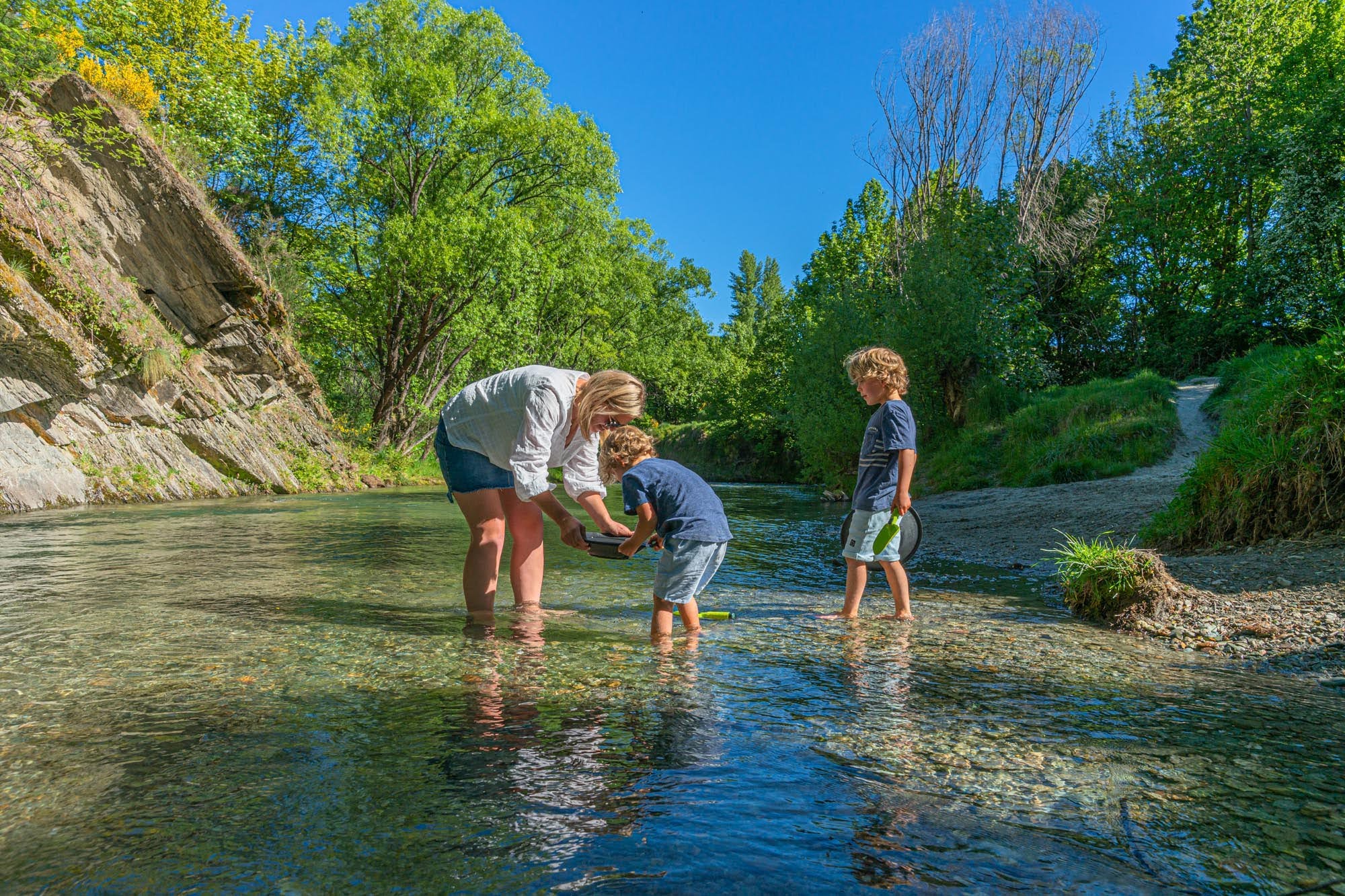 Gold panning mum children river