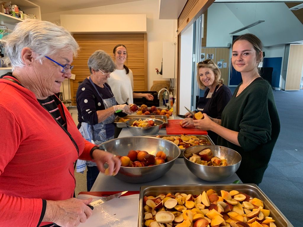 Baskets of Blessing 2024 volunteers give back - chopping